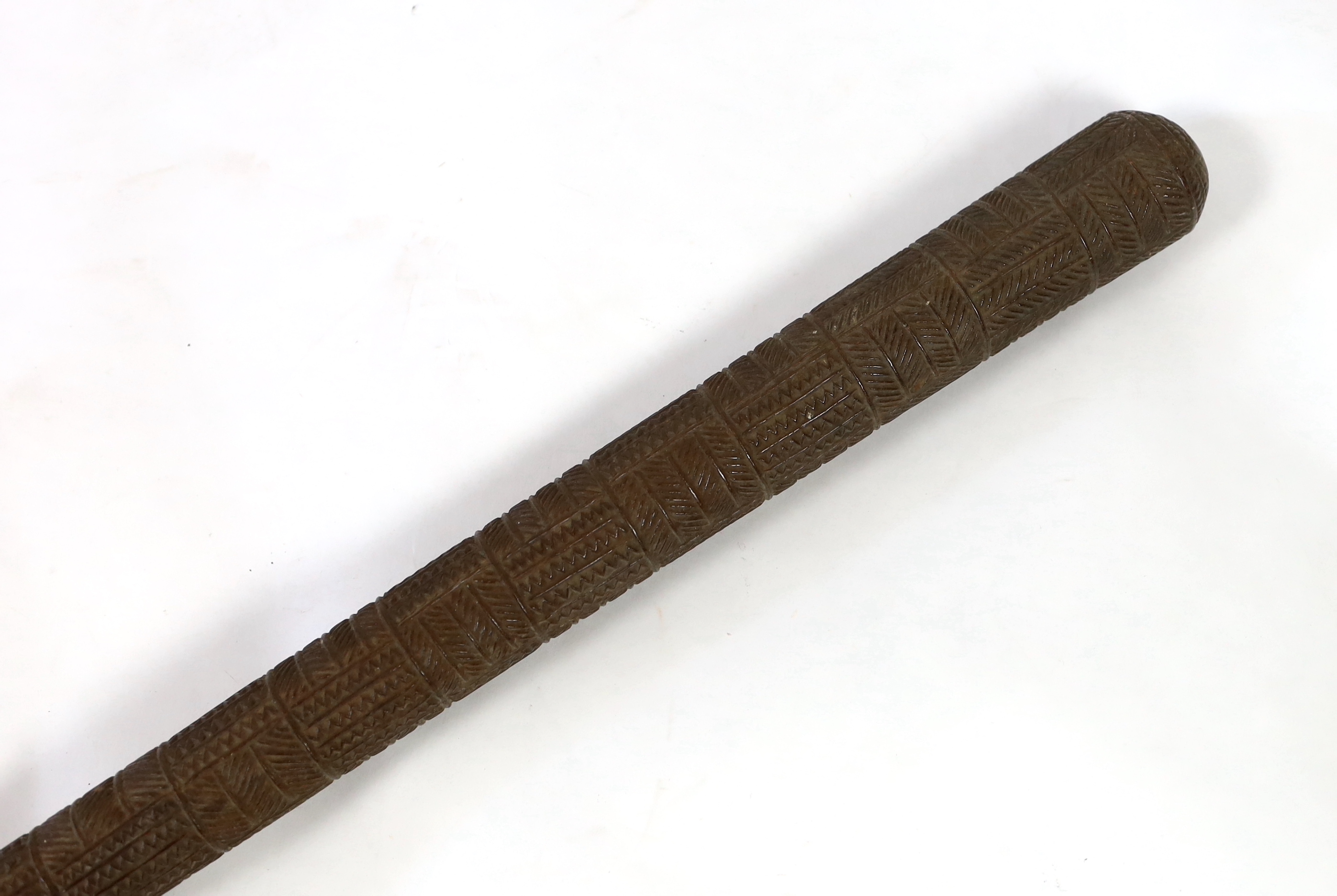 A Polynesian tribal Povai pole war club, Tonga, 19th century, 100cm long, 5cm largest diameter